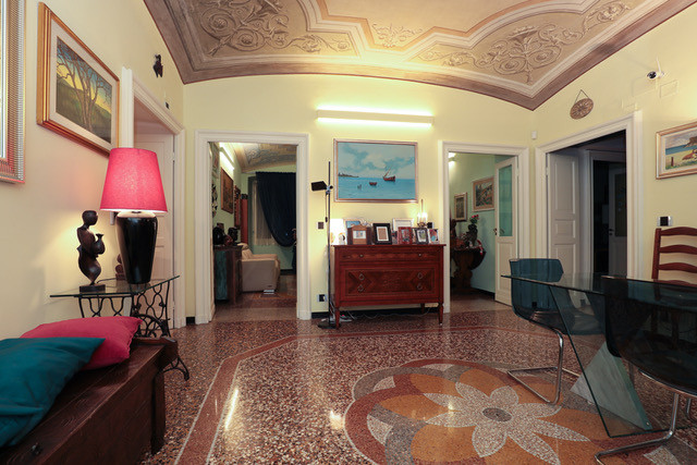 Restored apartment in historic building, Genova, with ornate ceiling