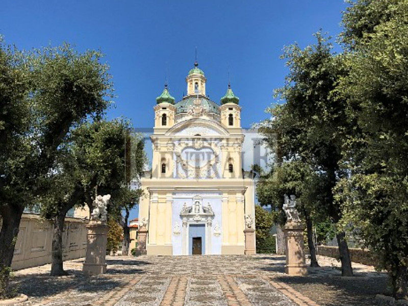 Church with trees and blue sky in Sanremo, Liguria